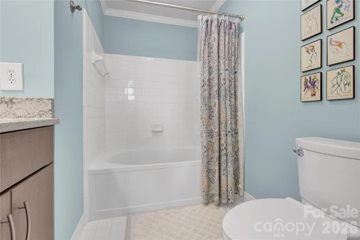 Primary Bathroom with large shower over tub.