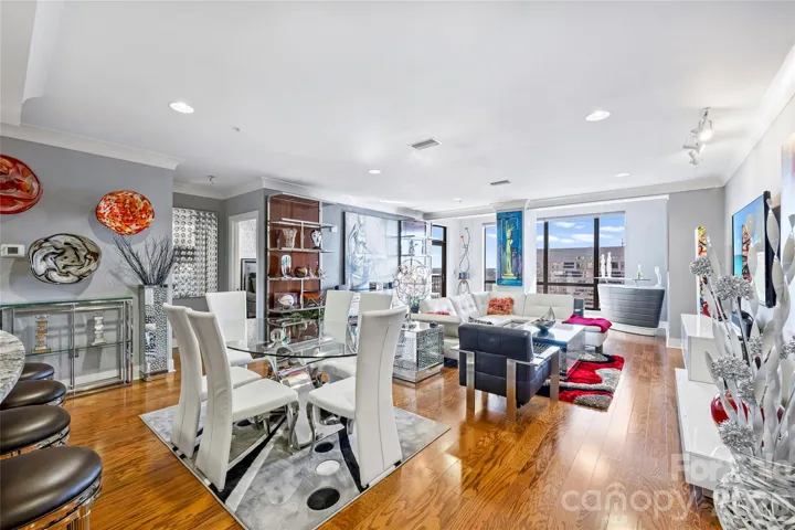 Bright and open living space with expansive windows and terrace access