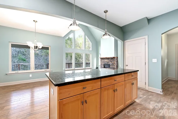 Kitchen view into dining and living room