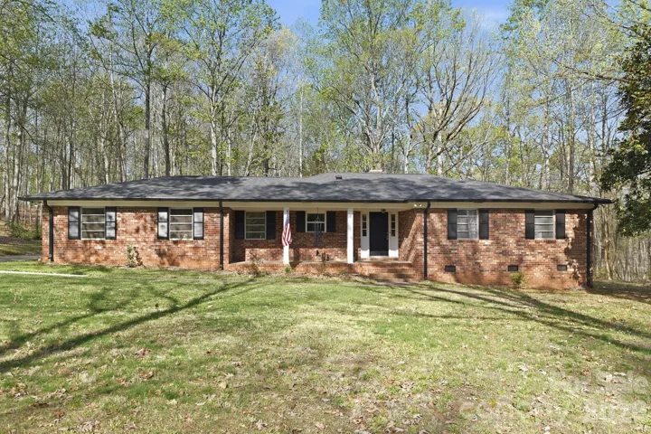Classic brick ranch on 2.6 acres in the city is a rare find!
