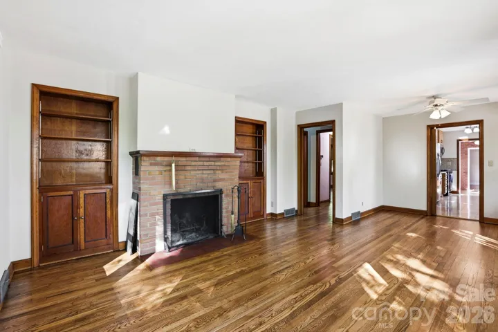 Original woodwork in living room and newly refinished floors!