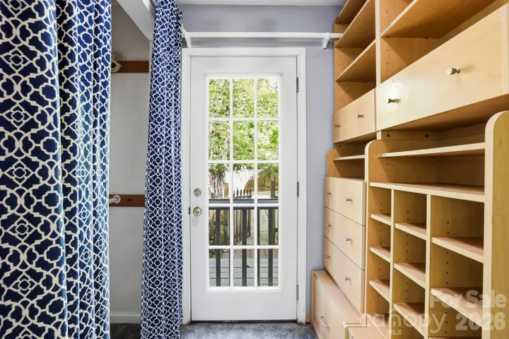 Primary suite 2 closet with exit to back patio.