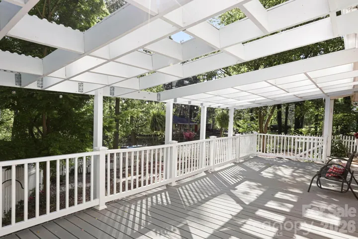Large front deck with pergola and lights