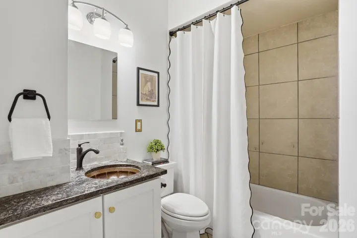 Full bathroom with hammered copper sink on the main level
