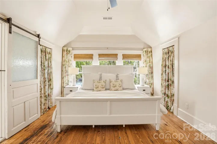 Primary bedroom abundant in natural light with en suite full bathroom