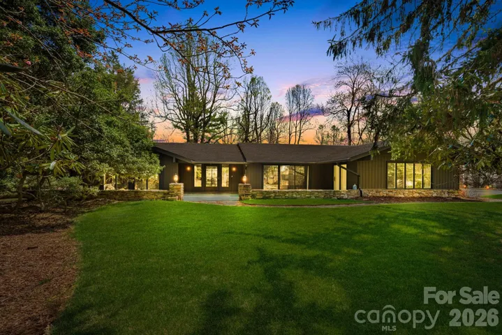 Mid century modern home with private lot on over an acre - virtual twilight