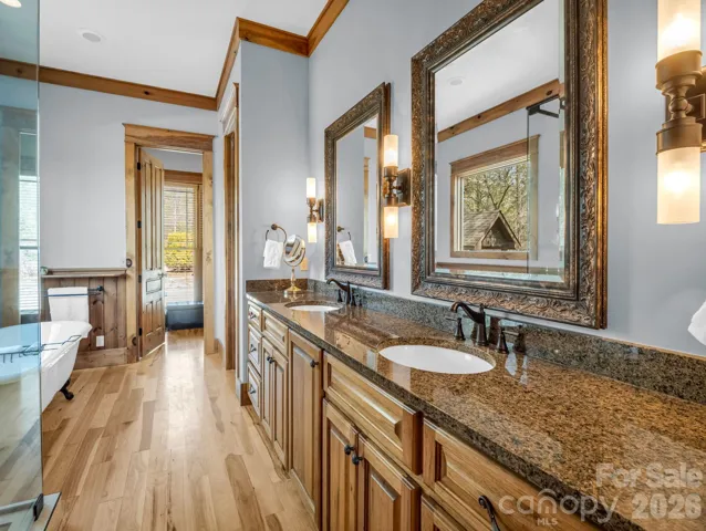 Primary bath leads into custom walk-in closet.