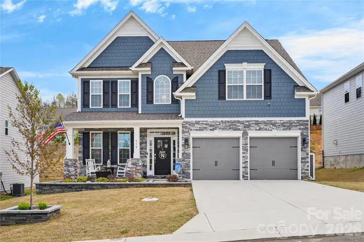 Beautiful curb appeal with custom hardscape.