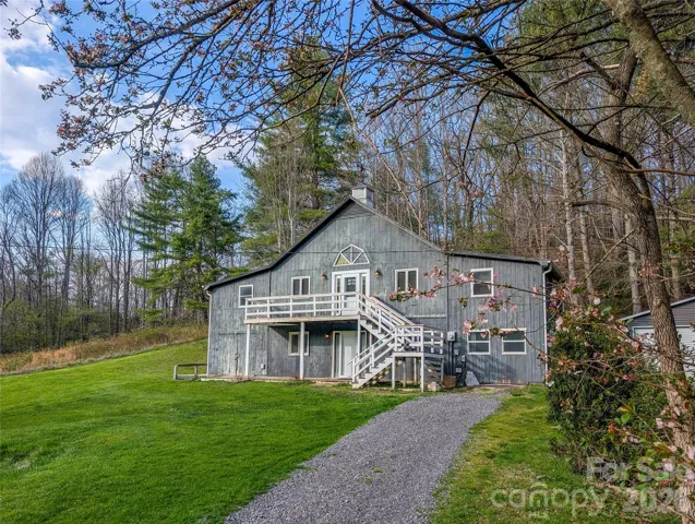 View of home from gravel driveway