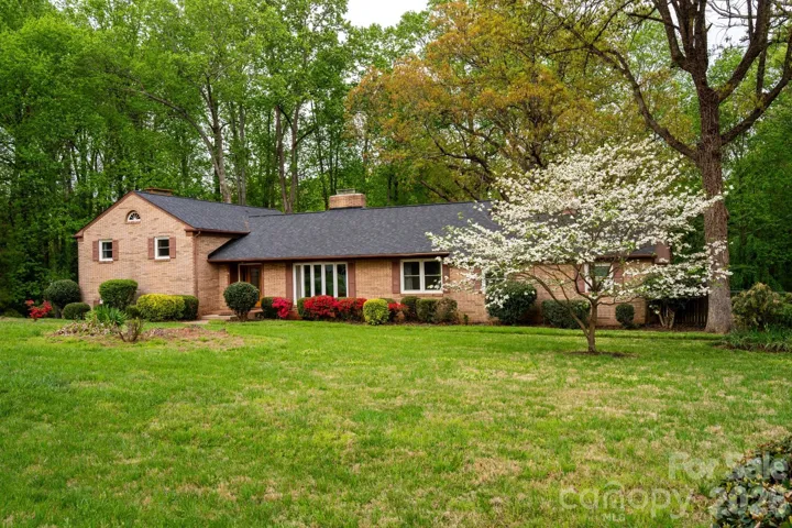 Charming brick ranch on 1.35 private acres