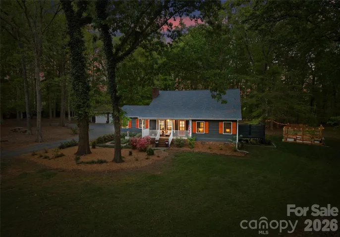 A stunning evening view that showcases the home’s curb appeal and warm exterior presence.