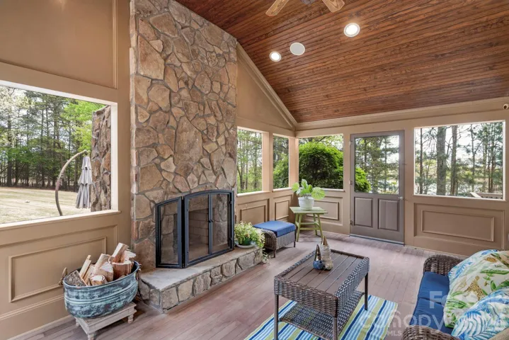 SCREEN PORCH AREA WITH LAKE VIEWS