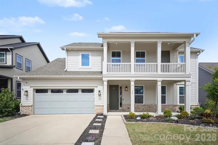 Welcome home! This gorgeous Craftsman-style home is truly move-in ready and loaded with upgrades. Enjoy outdoor living at its best with upper and lower porches, a covered back porch featuring a fireplace, and an extended patio—perfect for relaxing or entertaining.