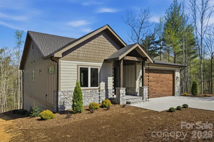 Welcome to 173 Waters Edge Dr in Nebo, NC. Located in The Arbor at Lake James. This new construction home sits on a .93 acre very private lot and includes a deeded boat slip.