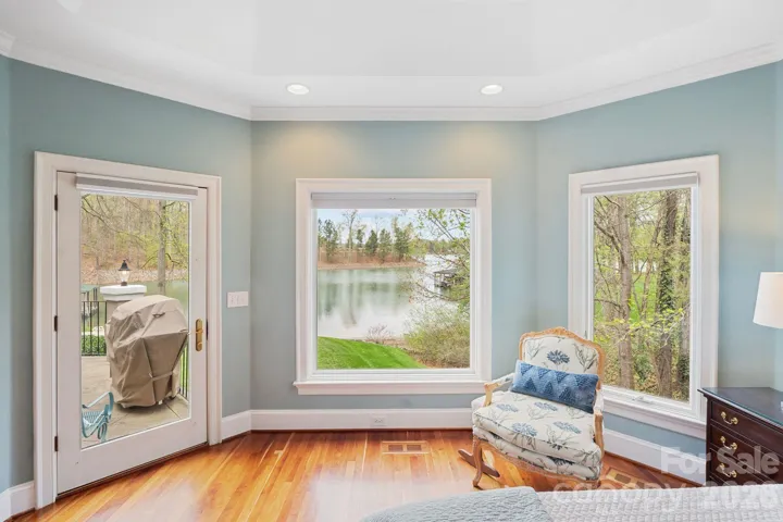 Primary bedroom sitting area and back patio access
