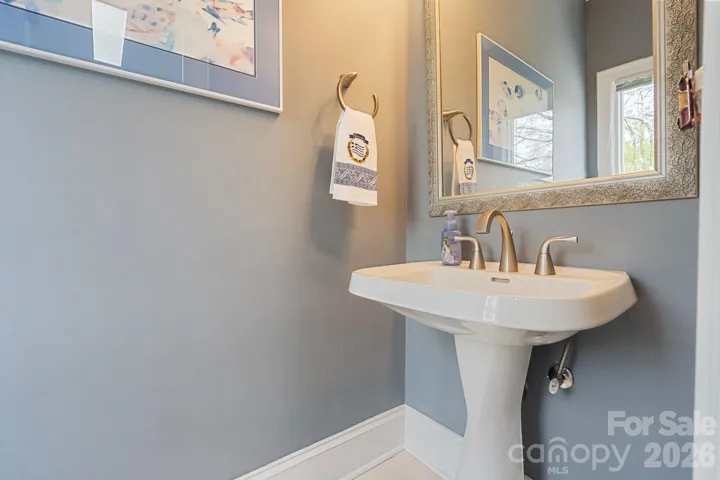 Main level half bath just off laundry room