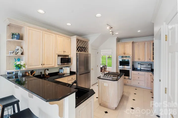 Bar seating, 2 sinks and 2 pantry's allow for function and storage