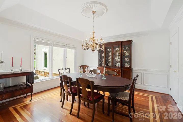 Formal dining room with ceiling and floor accents
