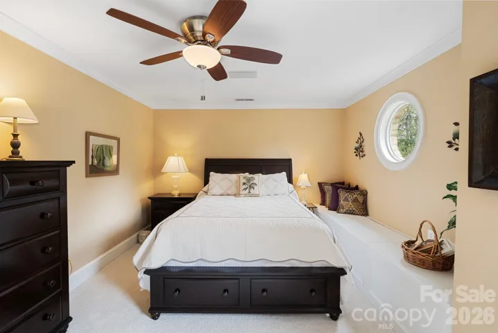 En suite guest bedroom with built in bench