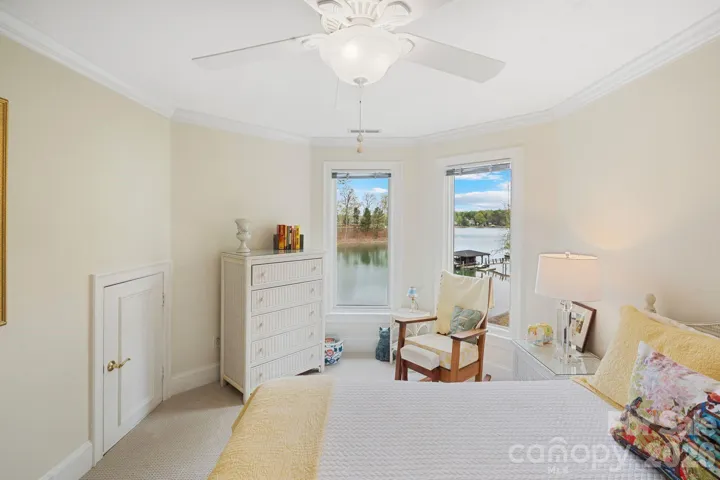 2nd guest bedroom with scenic lake views and attic storage 