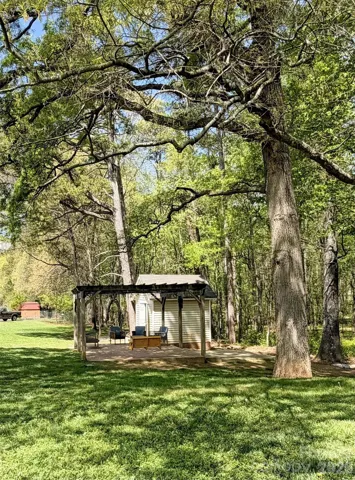 Pergola with patio near the shed. Lots of shade.