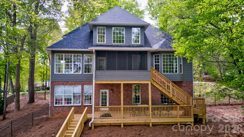 Gorgeous view of the back of the house from the lake.