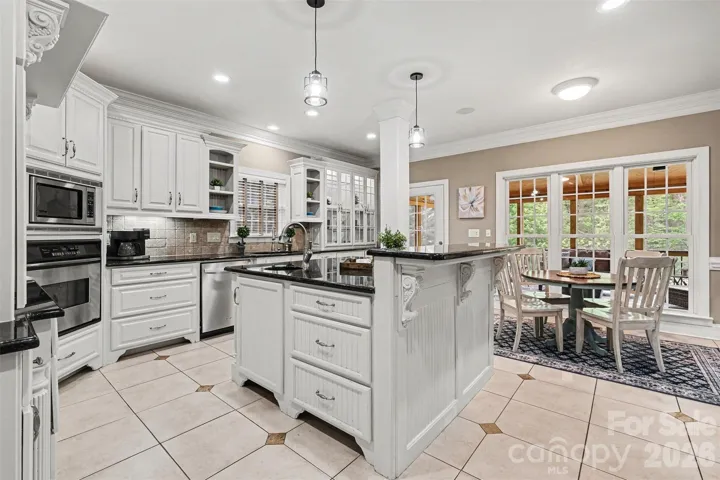 Spacious kitchen with island and dining area