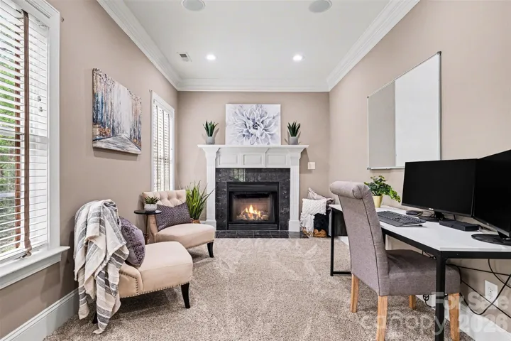Primary suite sitting area with fireplace