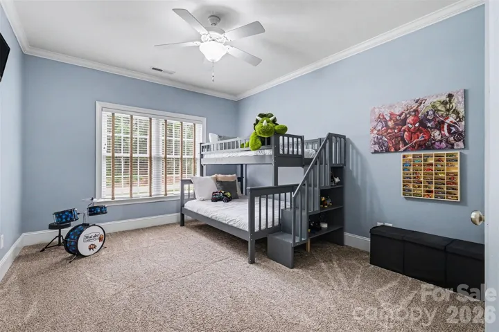 Secondary bedroom one with walk-in closet