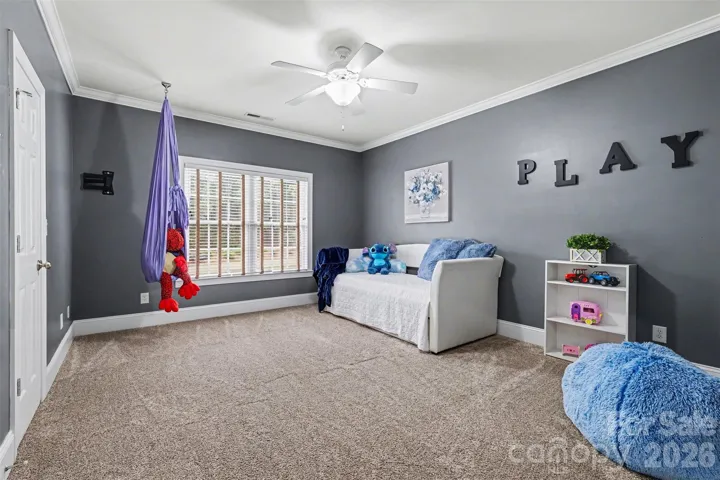 Secondary bedroom two with closet and walk-in attic storage