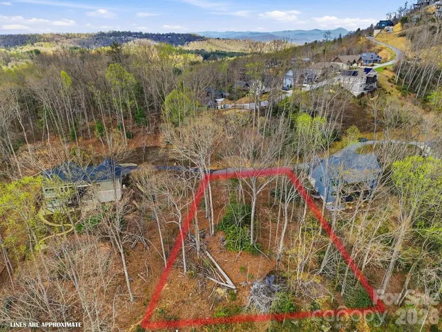 Welcome to the gated community of The Boulders! This .53-acre homesite on Garnet Way (Lot 13) offers year-round mountain view potential.