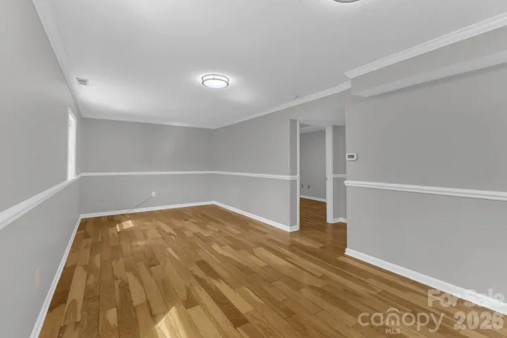 Family Room in Basement, hardwood floors