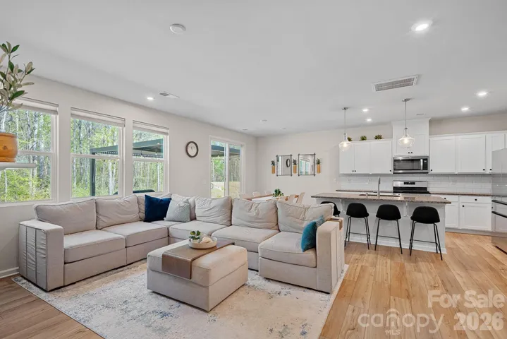 Open living space with dining area and island bar