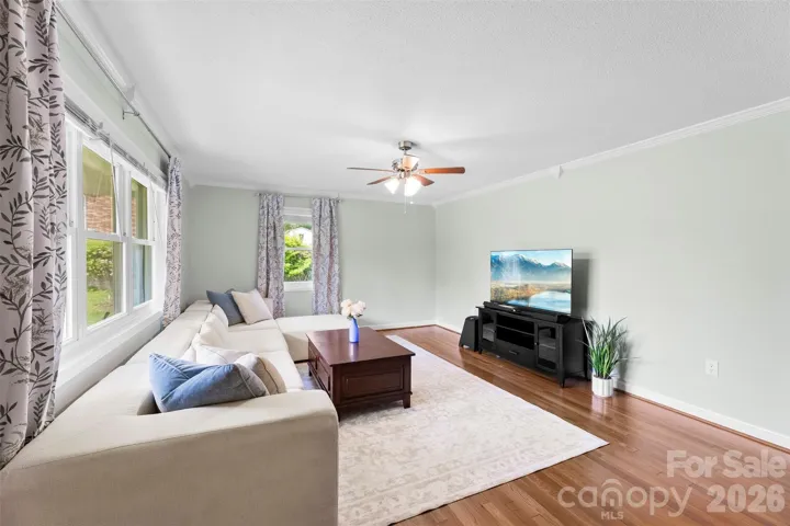 Living Room features wood floors, vinyl windows, cordless blinds, and an abundance of natural light.