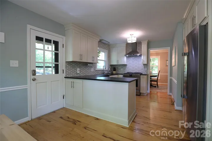 Updated Kitchen with New Cabinets, Countertops, Gas Range, Hood, and Appliances!