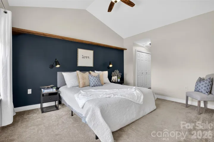 Large primary suite on main floor overlooks gorgeous pond views