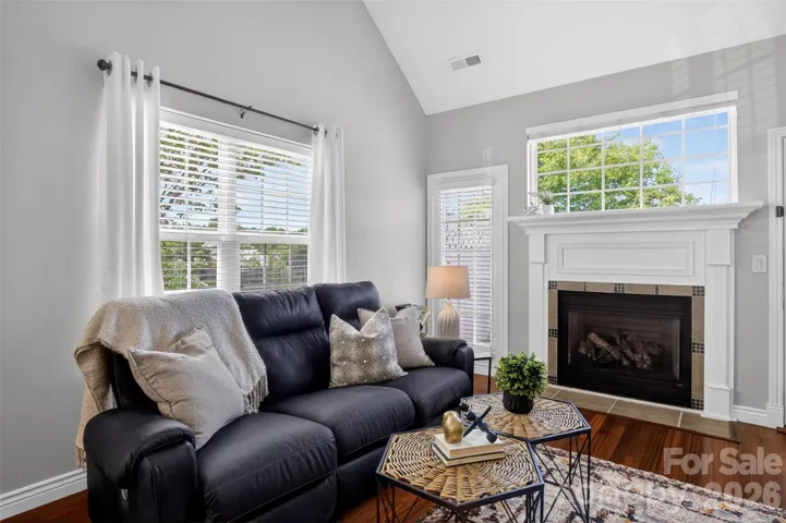Vaulted ceiling and fireplace in living area