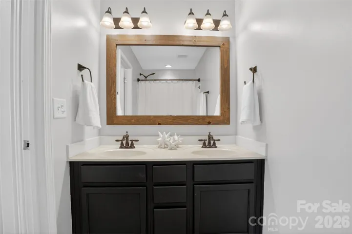 Primary bathroom has double sinks and garden tub with shower