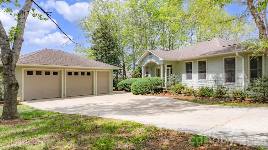 Featuring a 2 car garage w/ a golf cart entrance