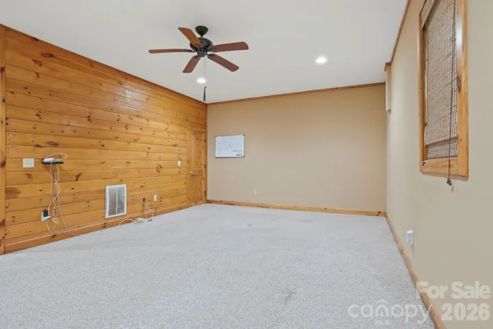 Flexible lower-level space with ample room for entertaining, office, or additional living area.