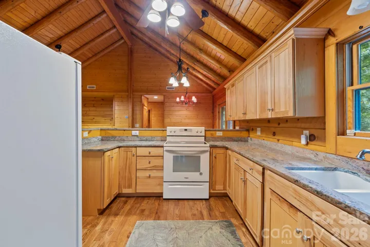 Well-appointed kitchen with granite countertops, ample cabinetry, and a functional layout designed for efficiency.