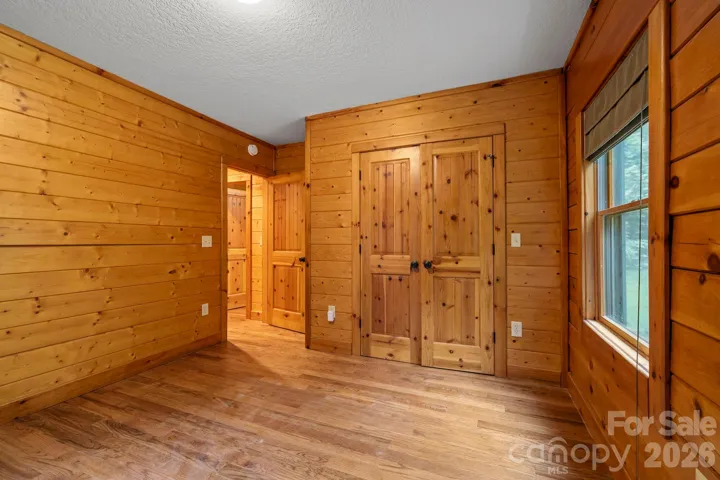 Versatile space with classic wood finishes and ample room for furnishings.