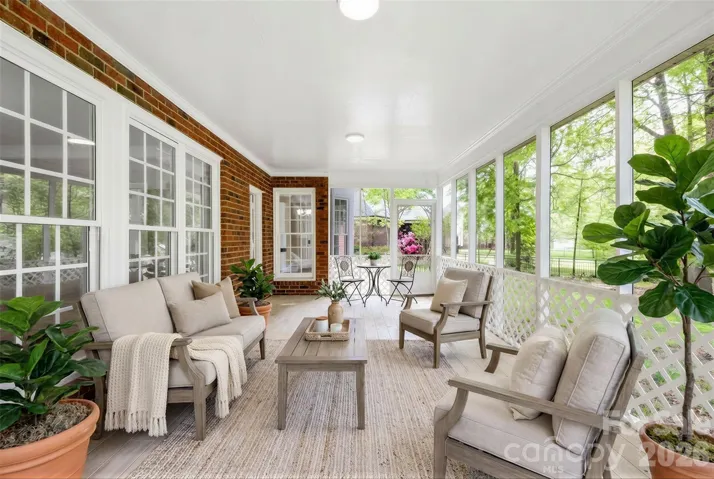 Large screen porch. Virtually staged.