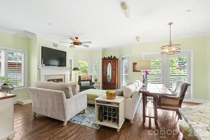 Inviting Living Room has ventless gas log; TV conveys; door to balcony