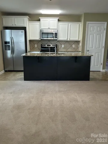 Kitchen island can seat 3 to 4 bar stools