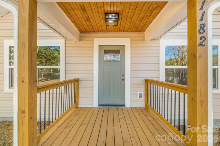 covered front entry with beadboard ceiling