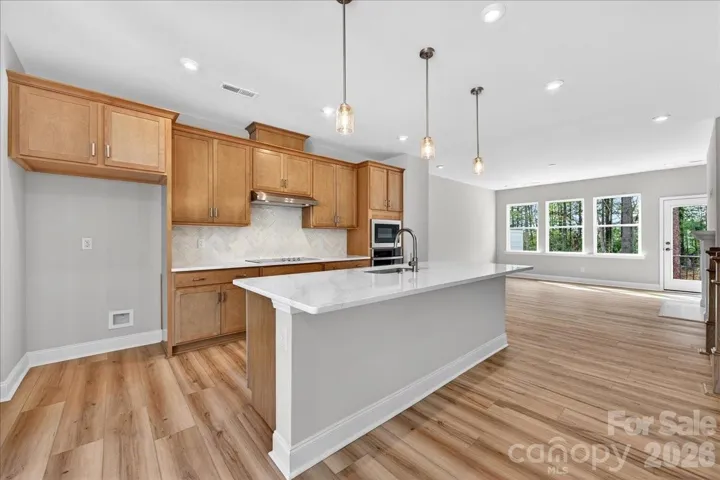 Gourmet Kitchen with brown cabinets
