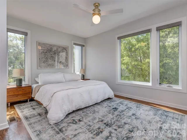 The Primary Corner Bedroom, Hardwood Floors, & Automatic  Black Out Blinds!