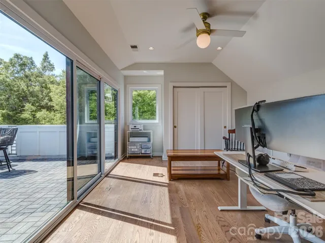 Full Guest Suite or Bonus Room on the Top Floor with a Full Bath, Hardwood Floors, Recessed & Fan Lighting, & Large Slider to the Rooftop Terrace!