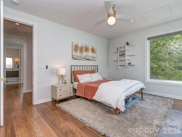 Huge Guest Suite with Hardwood Floors, Tons of Natural Light, and Automatic Black Out Blinds.